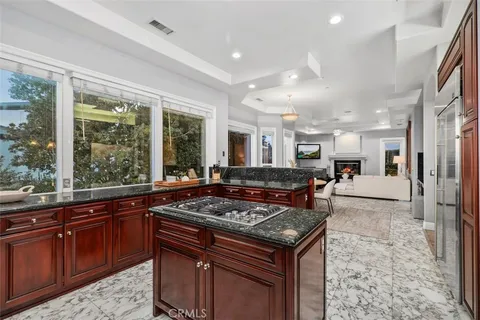 a bedroom with a large bed and a large window