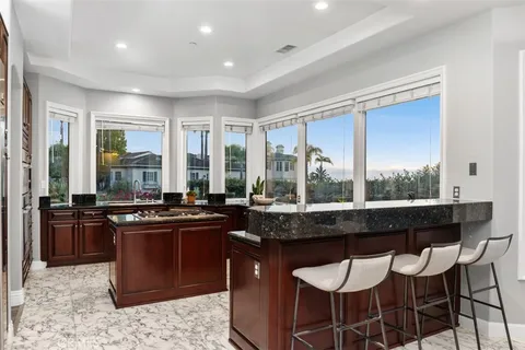 a bedroom with a bed and a ceiling fan