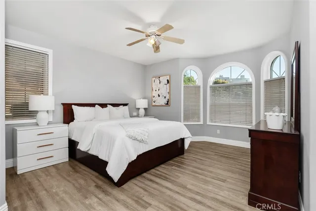 a bathroom with a granite countertop sink mirror and a bath tub