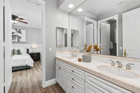 a bedroom with two beds and a window