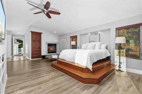 a kitchen with stainless steel appliances kitchen island granite countertop a wooden floors
