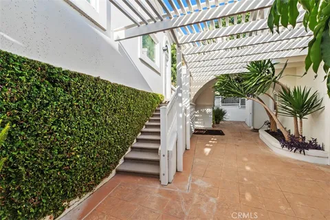a view of house with outdoor space and swimming pool