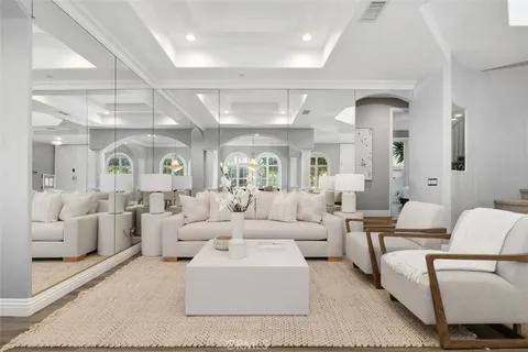 a living room with furniture white walls and white walls