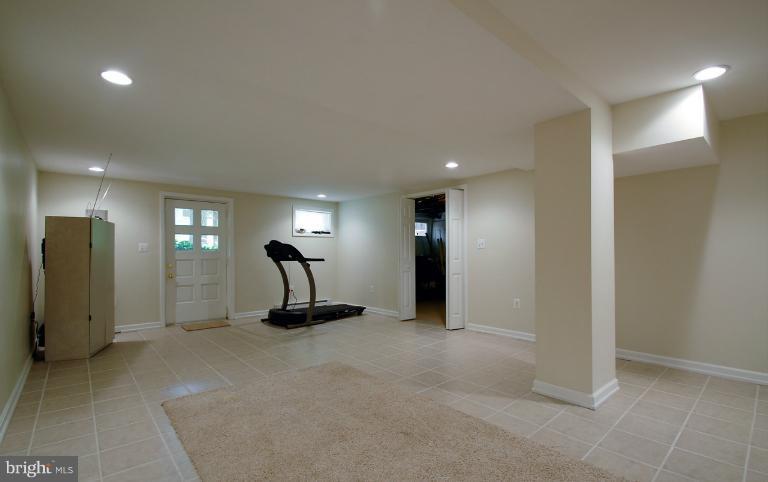8655 Geren Road, Unit 272 Silver Spring, MD 20901 - Photo 7 of 11 a view of a room with gym equipment