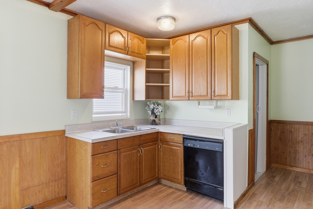 12 Whitcomb Street Webster, MA 01570 - Photo 11 of 40 a kitchen with a sink cabinets and wooden floor