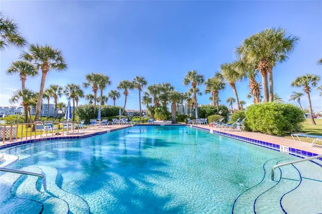 a kitchen with stainless steel appliances granite countertop a sink stove and microwave