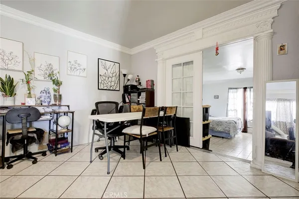 a view of a livingroom with workspace and a couch