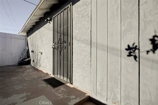 a view of a kitchen with a sink and a large window
