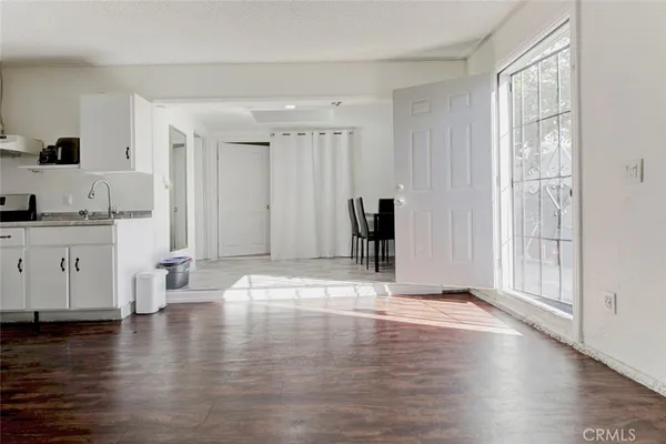 a kitchen with stainless steel appliances a sink and a refrigerator
