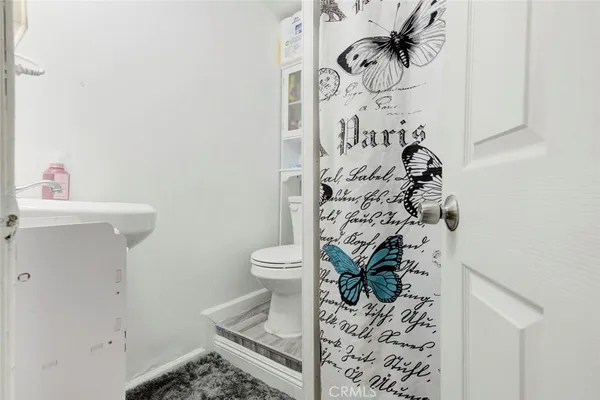 a bedroom with a bed and cabinet