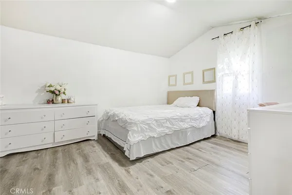 a bed room with a bed and a book shelf