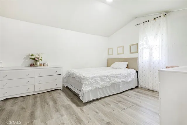 a bed room with a bed and a book shelf