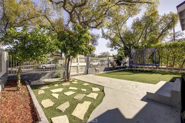 a view of swimming pool with seating space