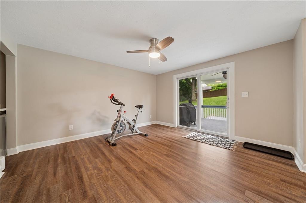 2047 Haymaker Road Monroeville, PA 15146 - Photo 11 of 31 a view of a room with gym equipment and a chandelier