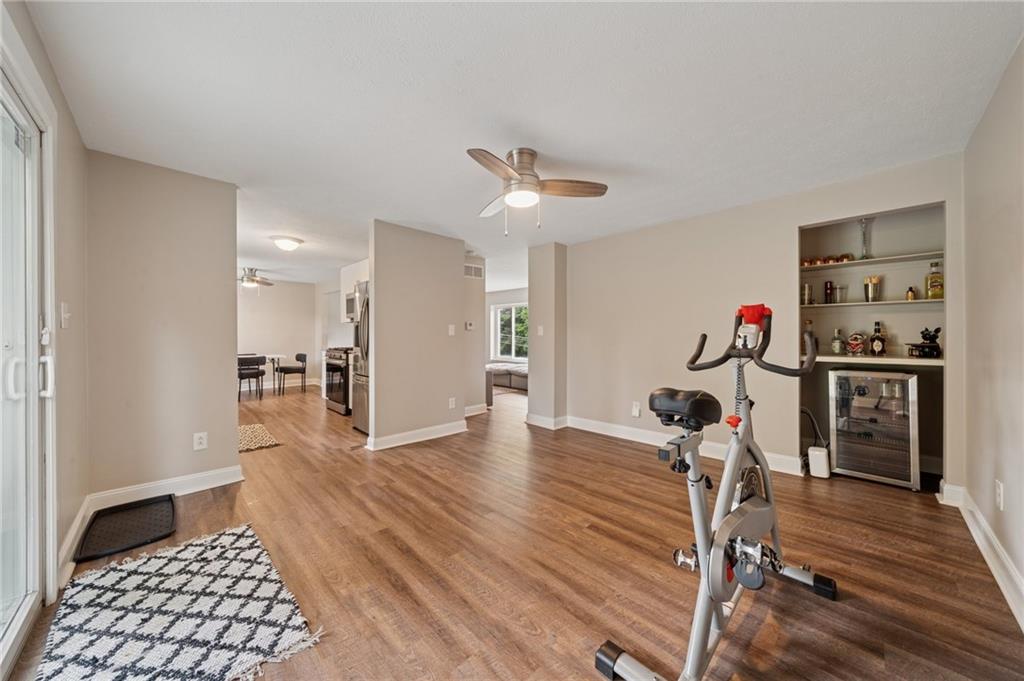 2047 Haymaker Road Monroeville, PA 15146 - Photo 12 of 31 a view of a livingroom with furniture hardwood floor and a ceiling fan