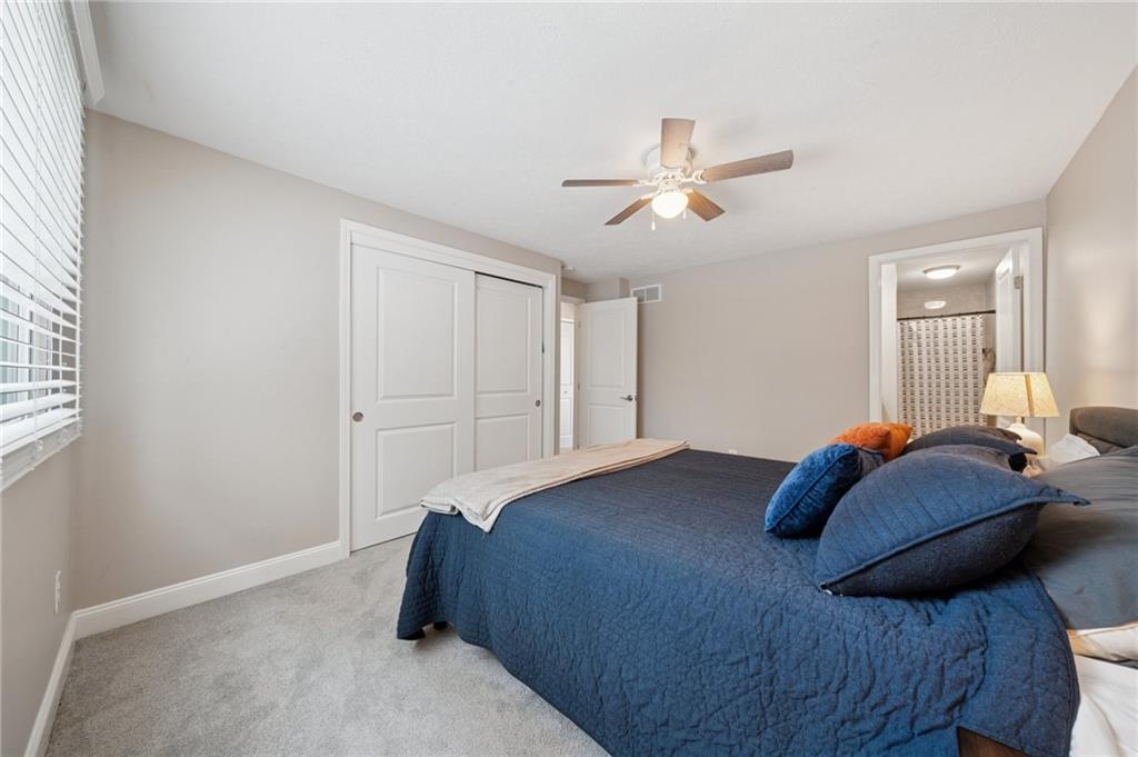 2047 Haymaker Road Monroeville, PA 15146 - Photo 15 of 31 a bedroom with a bed and a chandelier