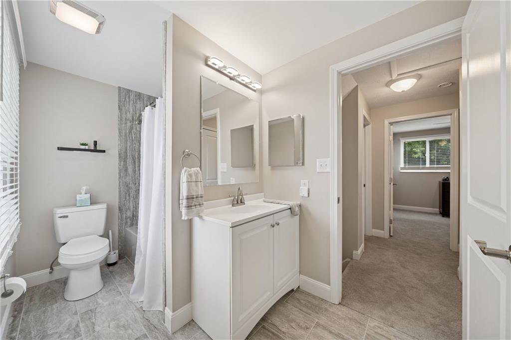 2047 Haymaker Road Monroeville, PA 15146 - Photo 16 of 31 a spacious bathroom with a toilet sink and mirror