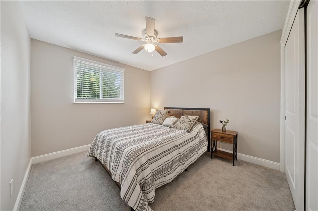 2047 Haymaker Road Monroeville, PA 15146 - Photo 17 of 31 a bedroom with a bed and a chandelier