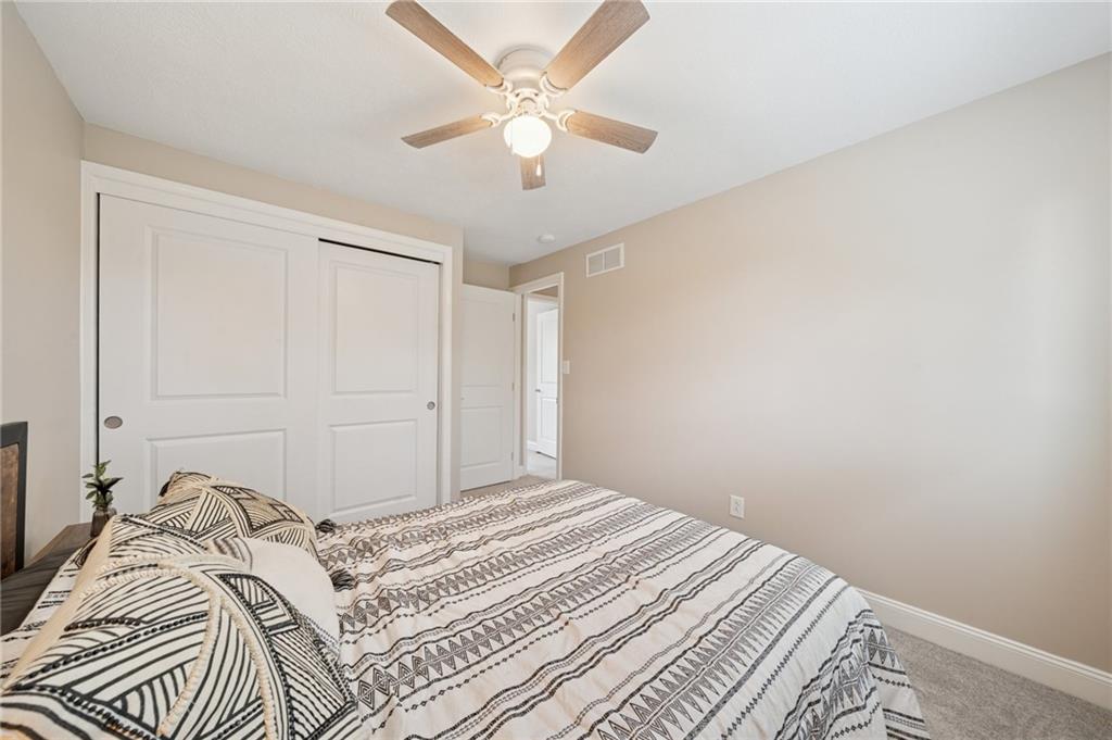 2047 Haymaker Road Monroeville, PA 15146 - Photo 18 of 31 a bedroom with a bed and a ceiling fan