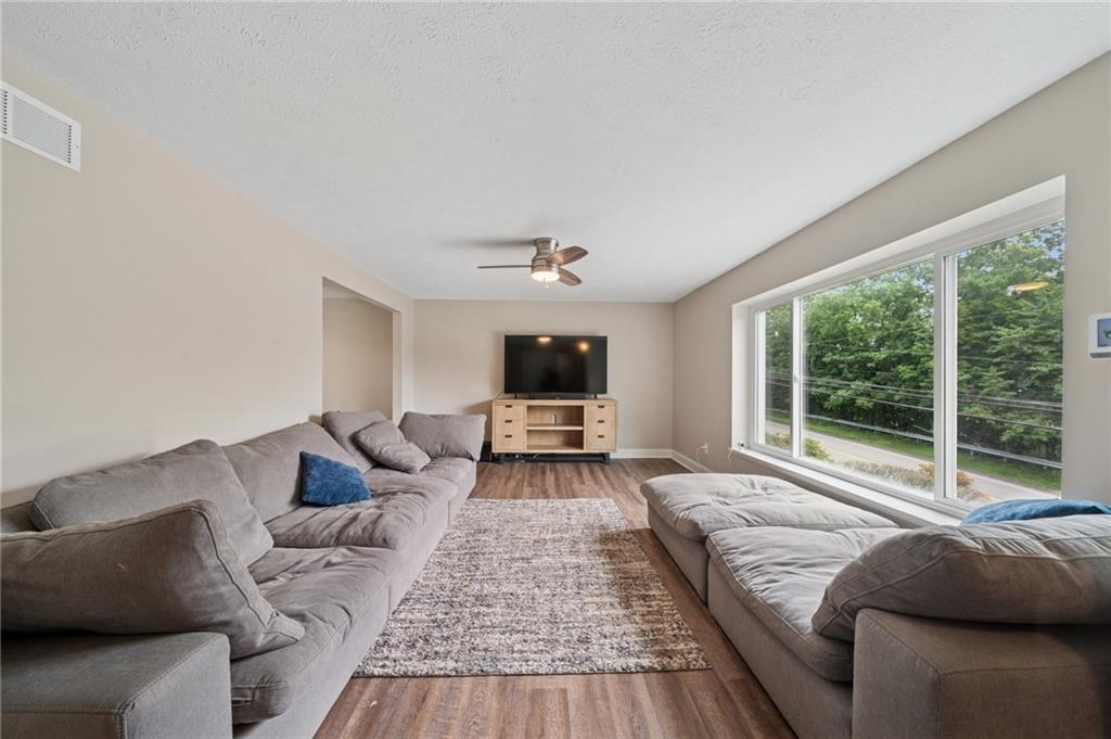 2047 Haymaker Road Monroeville, PA 15146 - Photo 2 of 31 a living room with furniture and a flat screen tv