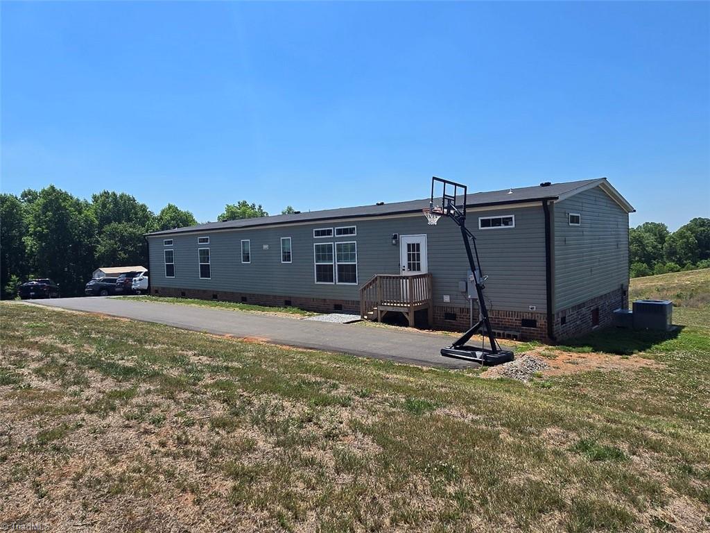 1266 Quaker Church Road Siloam, NC 27047 - Photo 3 of 29 Asphalt drive has warranty to Nov 2026