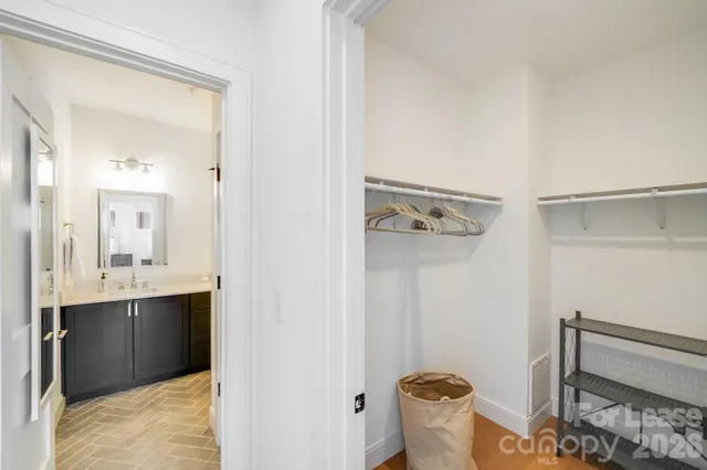 a bathroom with 2 sink and a mirror