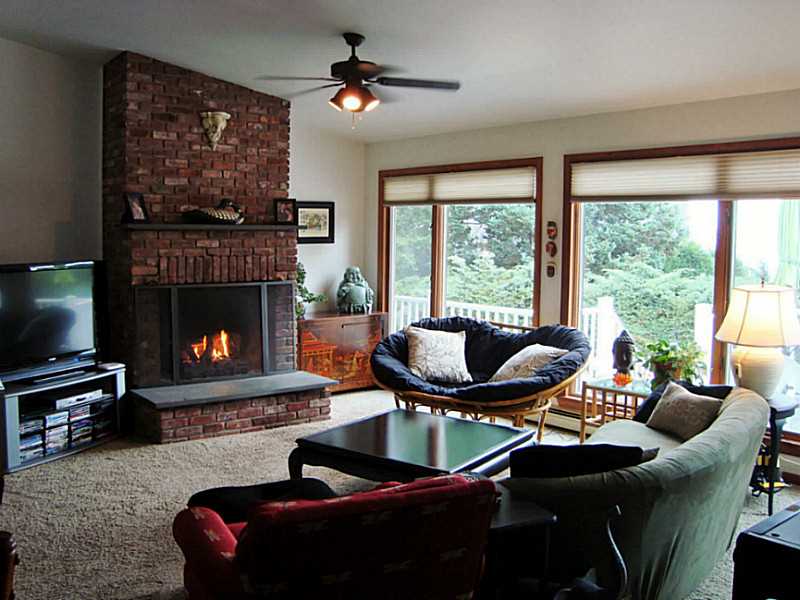 26 Decatur Avenue Jamestown, RI 02835 - Photo 5 of 20 Den/Family/Great Room. Cathedral ceilings and a brick fireplace with a gas insert