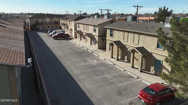 an aerial view of a house with a yard