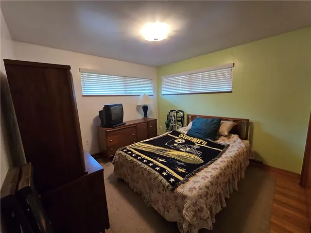 a bedroom with furniture and a window