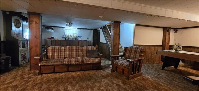 a bedroom with furniture and a wooden floor