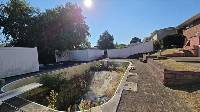 a view of a backyard with sitting area