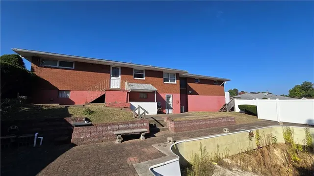 a front view of a house with a garage