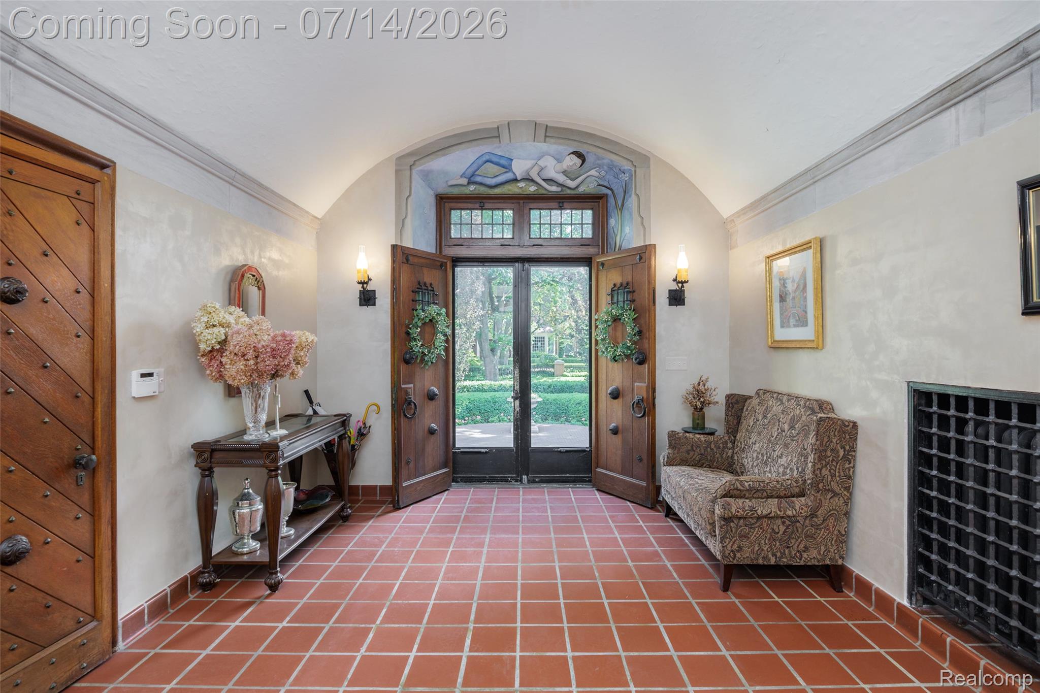 189 Cloverly Road Grosse Pointe, MI 48236 - Photo 6 of 96 Foyer with terracotta tile flooring, arched entryway, and custom double wood doors