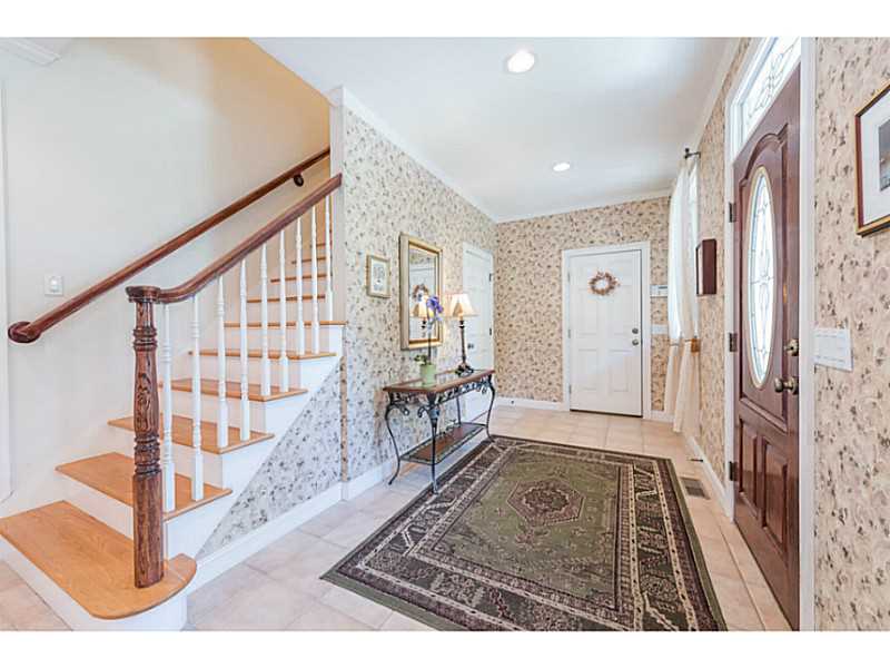 168 Kingston Road Exeter, RI 02822 - Photo 17 of 25 Entry. Separate entry foyer for in-law space. One door comes in from the four car garage. Stairs lead to a bonus room/studio above.