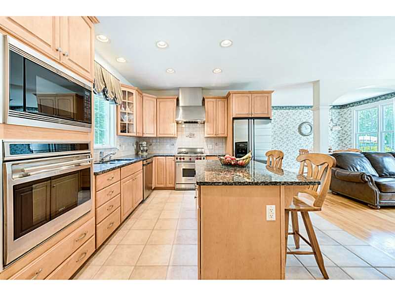 168 Kingston Road Exeter, RI 02822 - Photo 18 of 25 Kitchen. In-law / guest area. Well appointed kitchen with center island and Wolf gas stove.