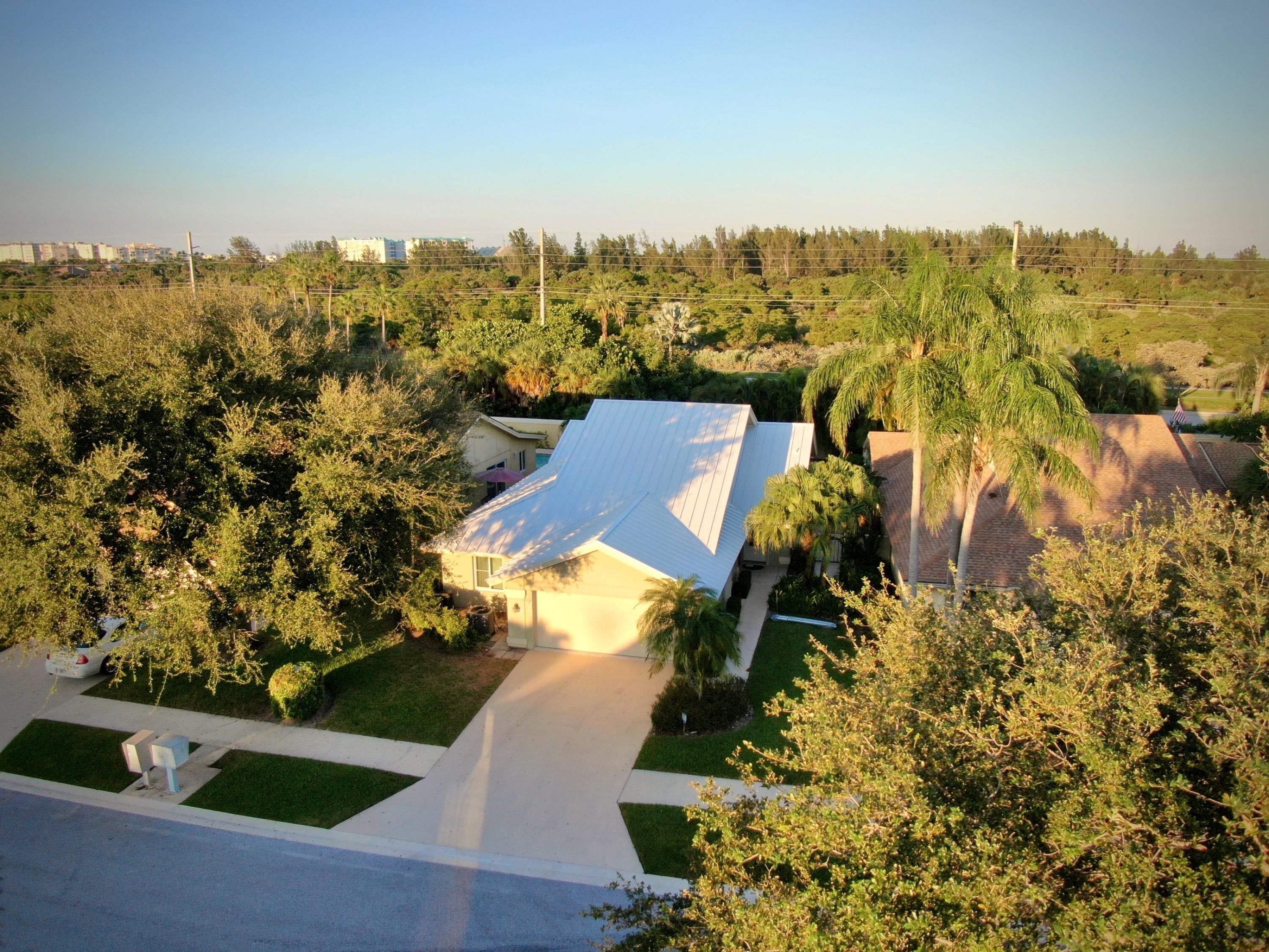 155 Seashore Drive Jupiter, FL 33477 - Photo 4 of 32 Tree lined street