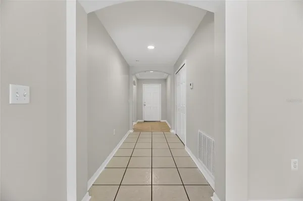 a kitchen with stainless steel appliances a refrigerator and a stove top oven