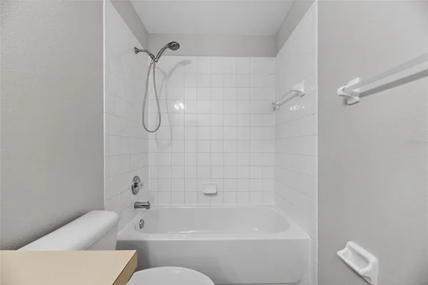 a view of storage and utility room with washer and dryer