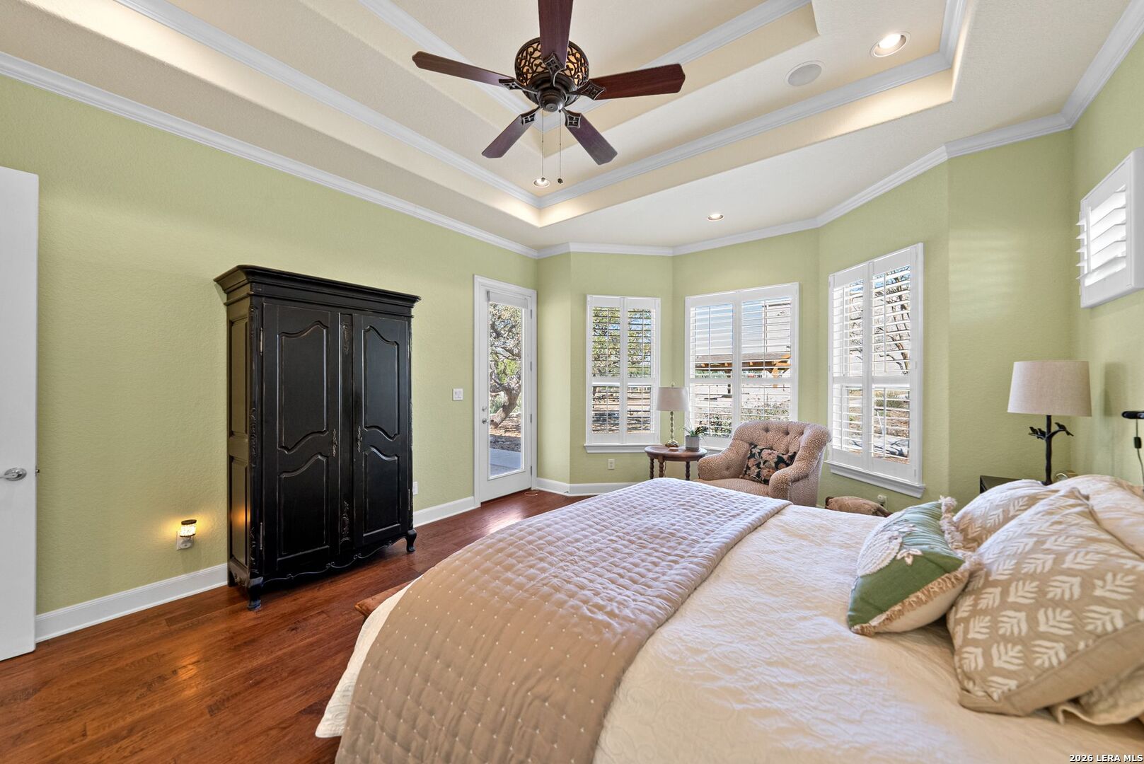 970 Flightline Spring Branch, TX 78070 - Photo 11 of 40 a bedroom with a bed and a chandelier
