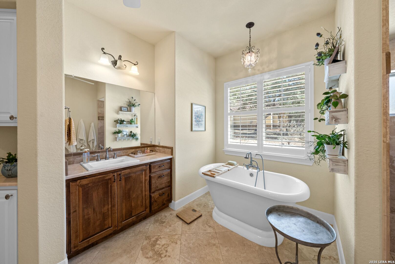 970 Flightline Spring Branch, TX 78070 - Photo 12 of 40 a spacious bathroom with a granite countertop sink a mirror and a bathtub
