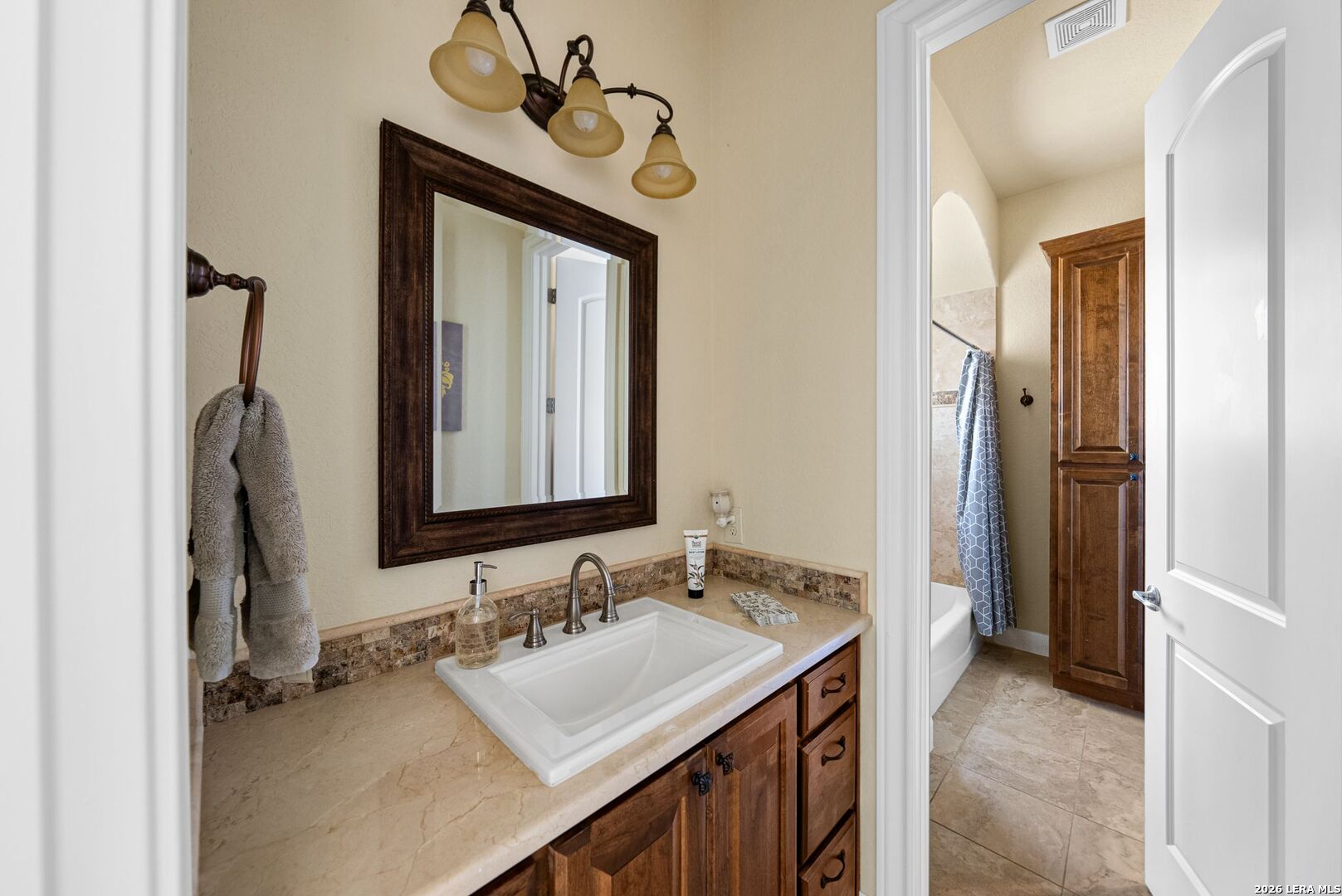 970 Flightline Spring Branch, TX 78070 - Photo 16 of 40 a bathroom with a sink and a mirror