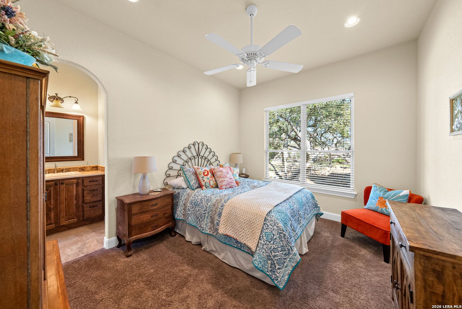 970 Flightline Spring Branch, TX 78070 - Photo 17 of 40 a bedroom with a bed and a chandelier