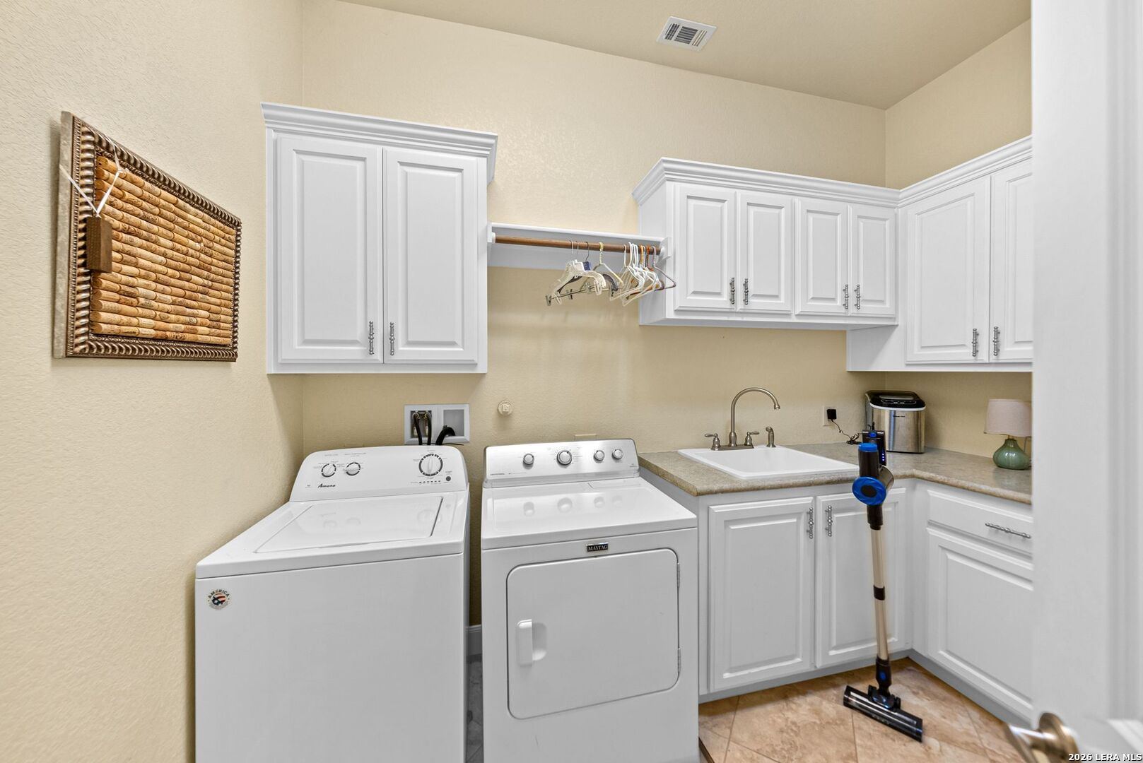 970 Flightline Spring Branch, TX 78070 - Photo 24 of 40 a view of cabinets a washer and dryer