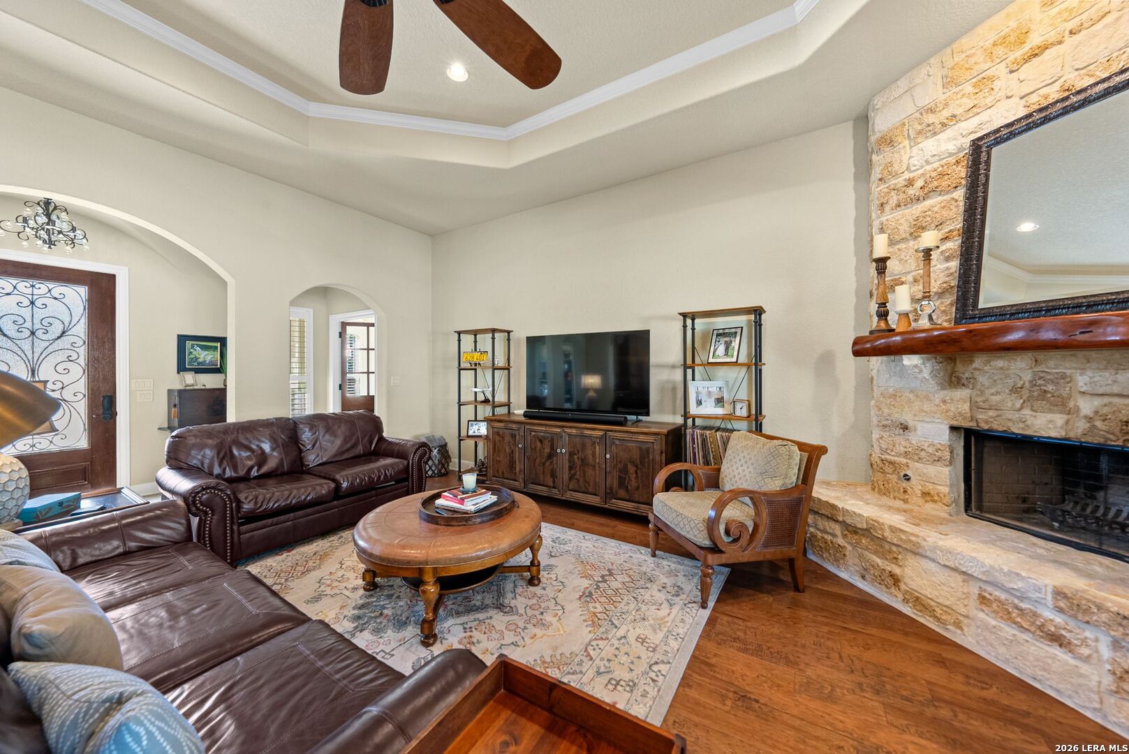 970 Flightline Spring Branch, TX 78070 - Photo 5 of 40 a living room with furniture a flat screen tv and a fireplace