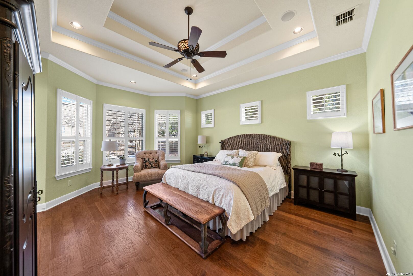 970 Flightline Spring Branch, TX 78070 - Photo 10 of 40 a spacious bedroom with a bed and a chandelier