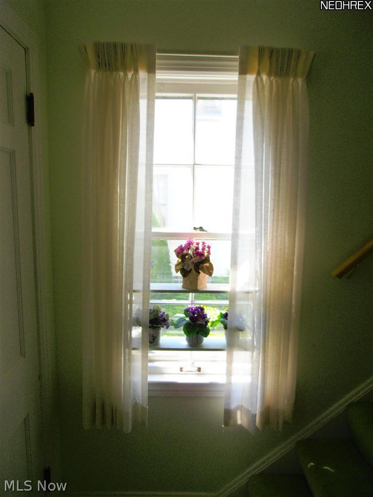 1052 Piermont Road Cleveland, OH 44121 - Photo 5 of 21 Window at the base of the staircase which leads to the second floor