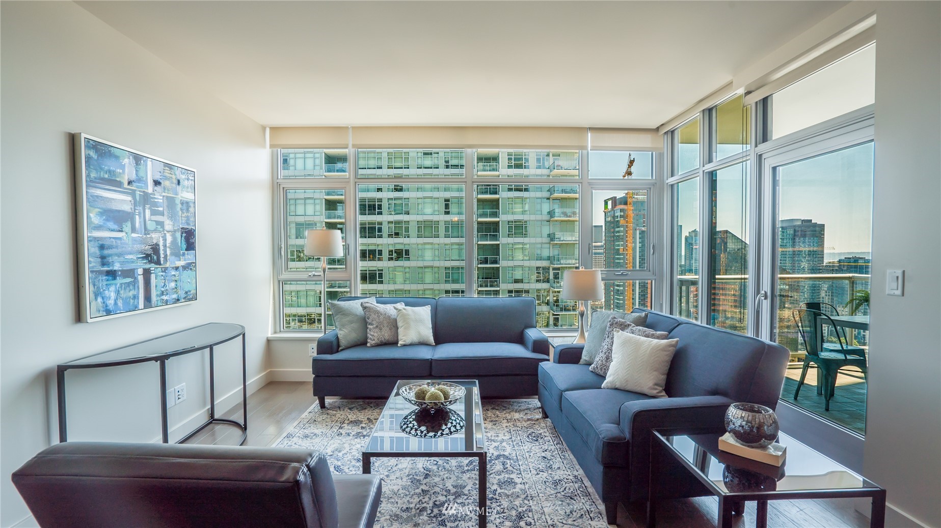 583 Battery Street, Unit 3207N Seattle, WA 98121 - Photo 3 of 22 a living room with furniture and a floor to ceiling window