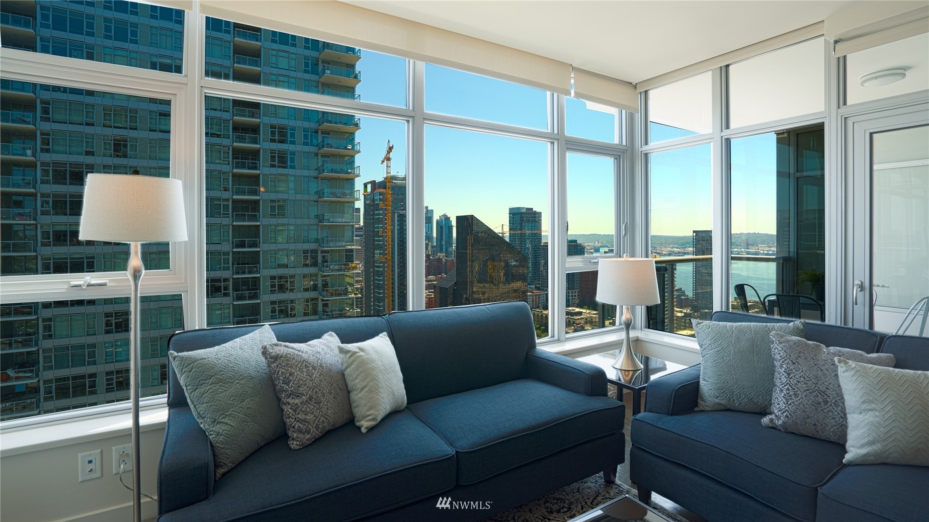 583 Battery Street, Unit 3207N Seattle, WA 98121 - Photo 4 of 22 a living room with furniture and a window