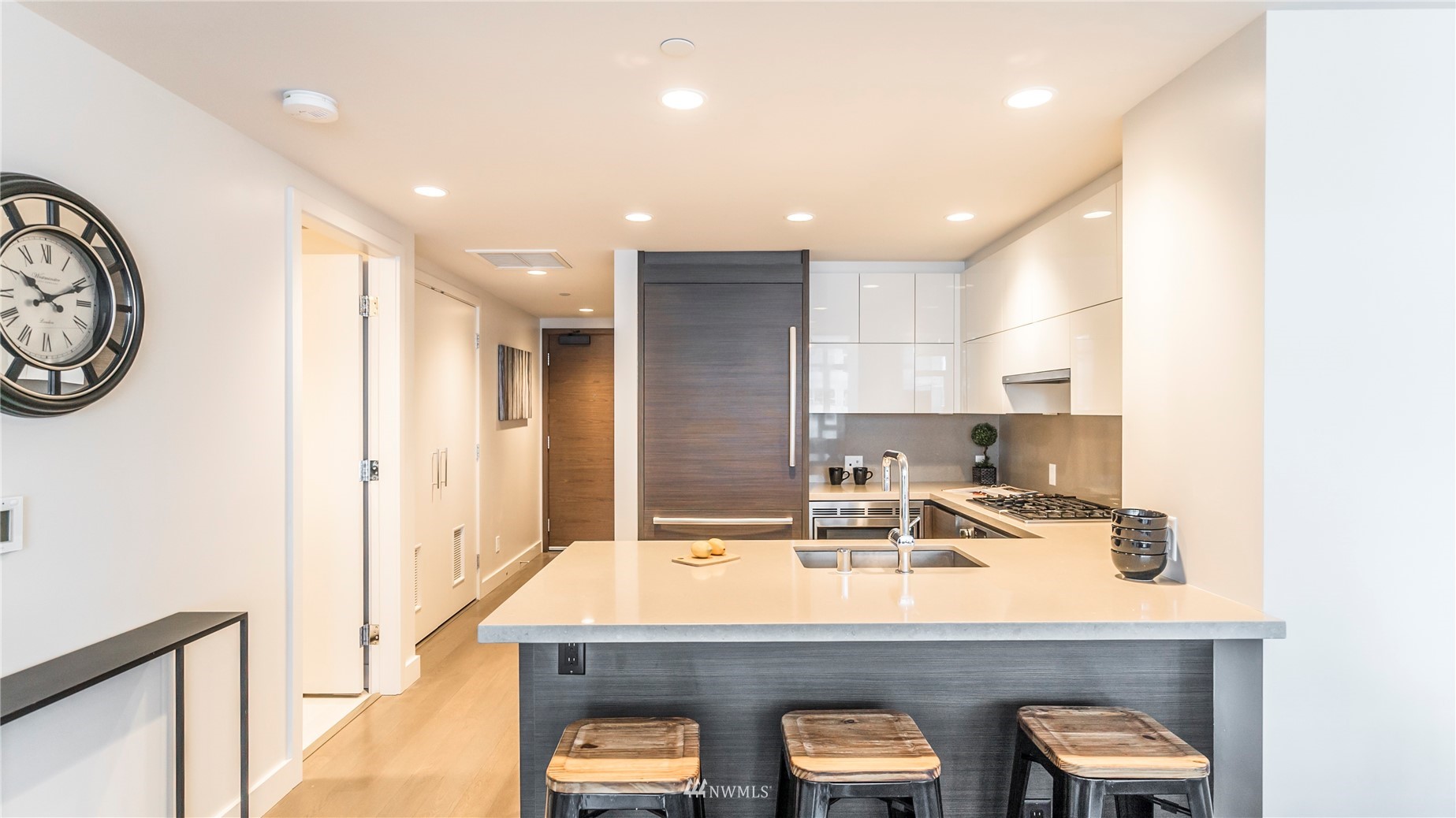 583 Battery Street, Unit 3207N Seattle, WA 98121 - Photo 6 of 22 a kitchen with kitchen island a sink appliances and cabinets