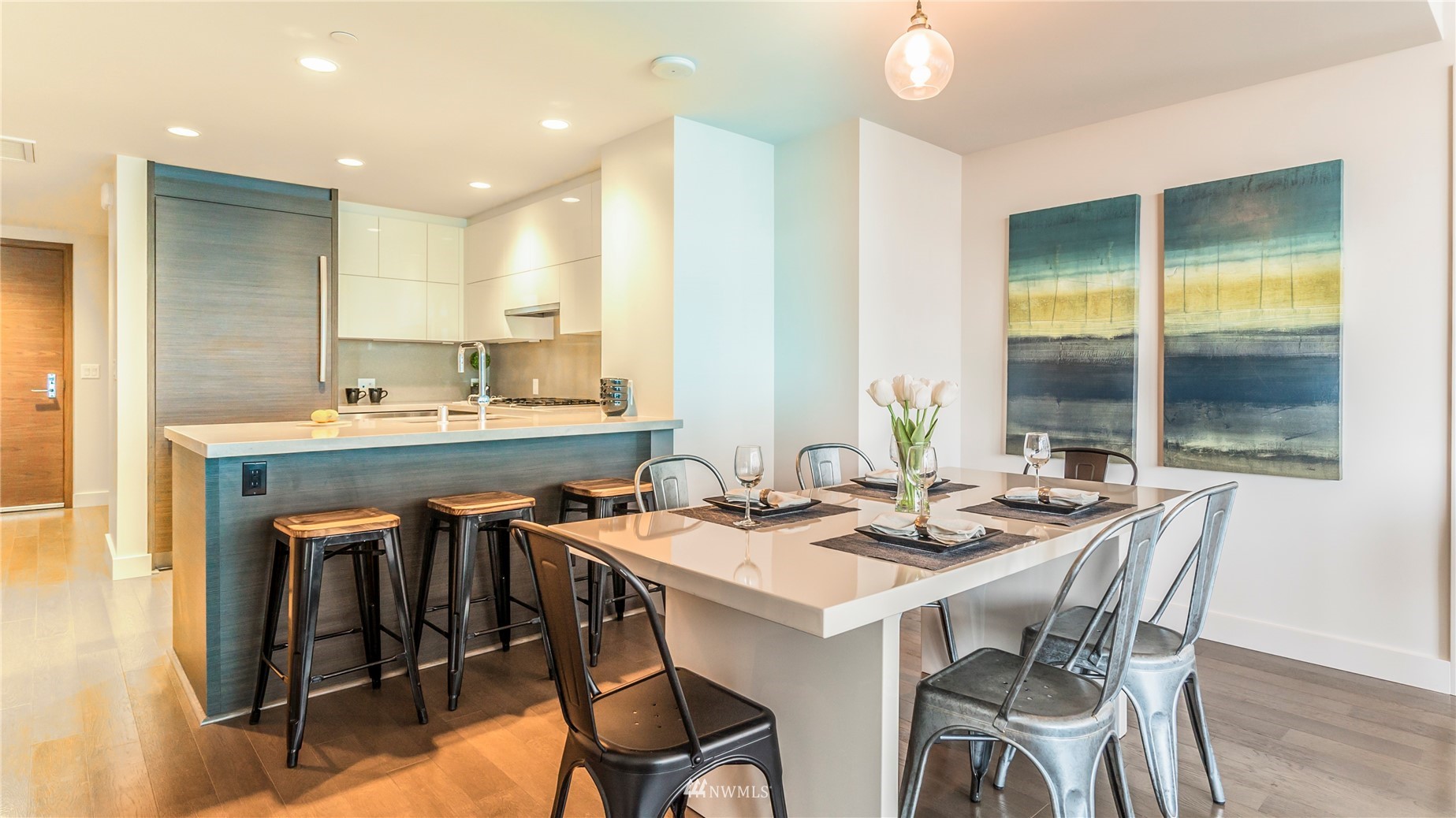 583 Battery Street, Unit 3207N Seattle, WA 98121 - Photo 7 of 22 a dining room with stainless steel appliances kitchen island granite countertop a sink and a granite counter tops